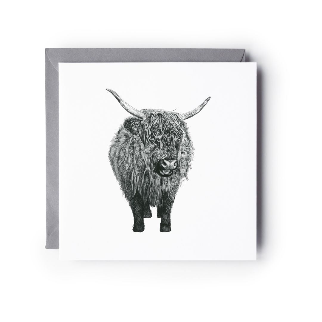 A delicate hand-drawn baby Highland Cow greeting card, printed on Libra Fine Arts cardstock for a premium touch. The card with a grey envelope behind it, highlighting its elegant design. The inside is blank, perfect for adding a personal message. Ideal for Highland cow lovers, special occasions like birthdays, baby showers, thank you notes, or just because.