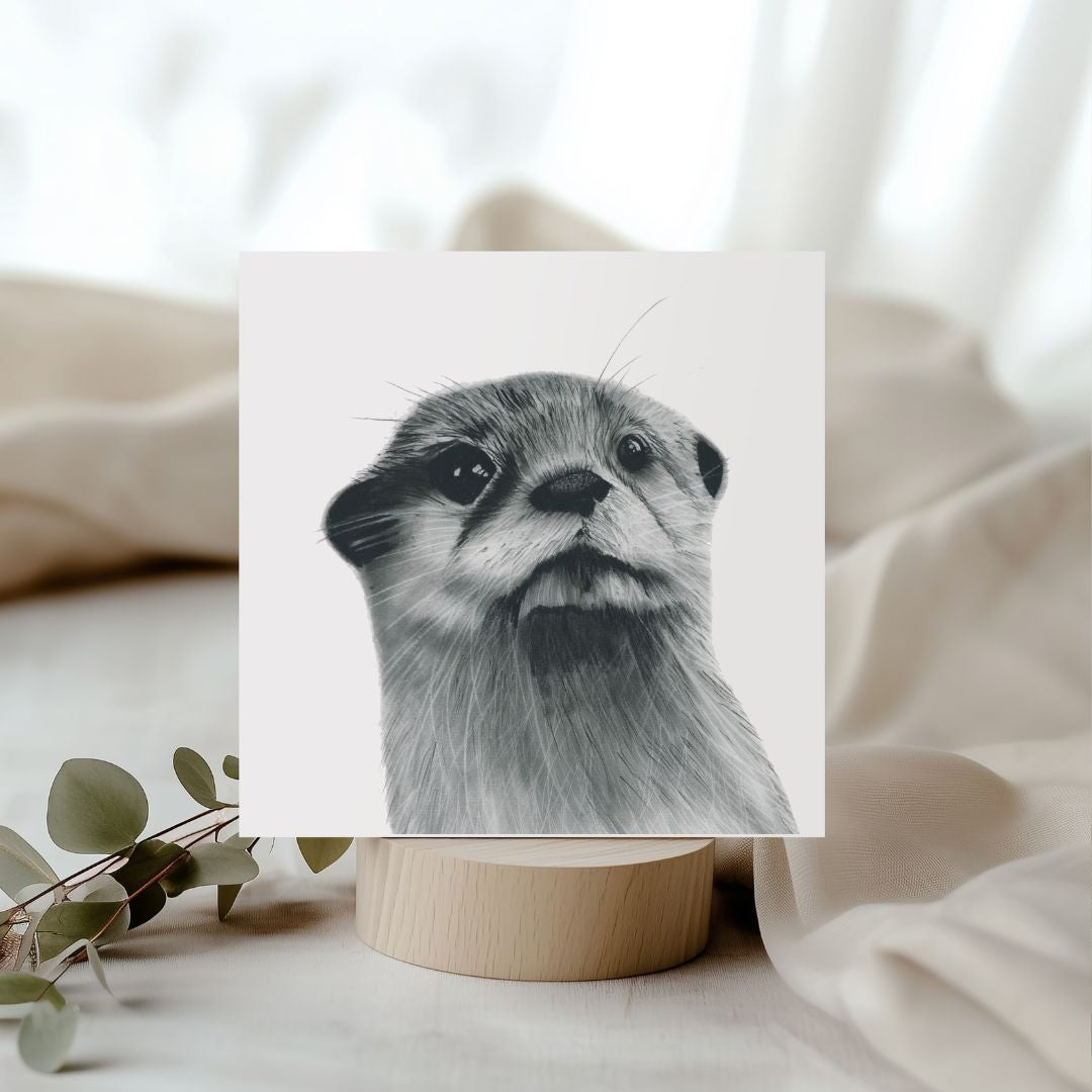 Charming hand-illustrated greeting card featuring Buna the otter, ideal for sending joyful wishes to otter and animal enthusiasts.