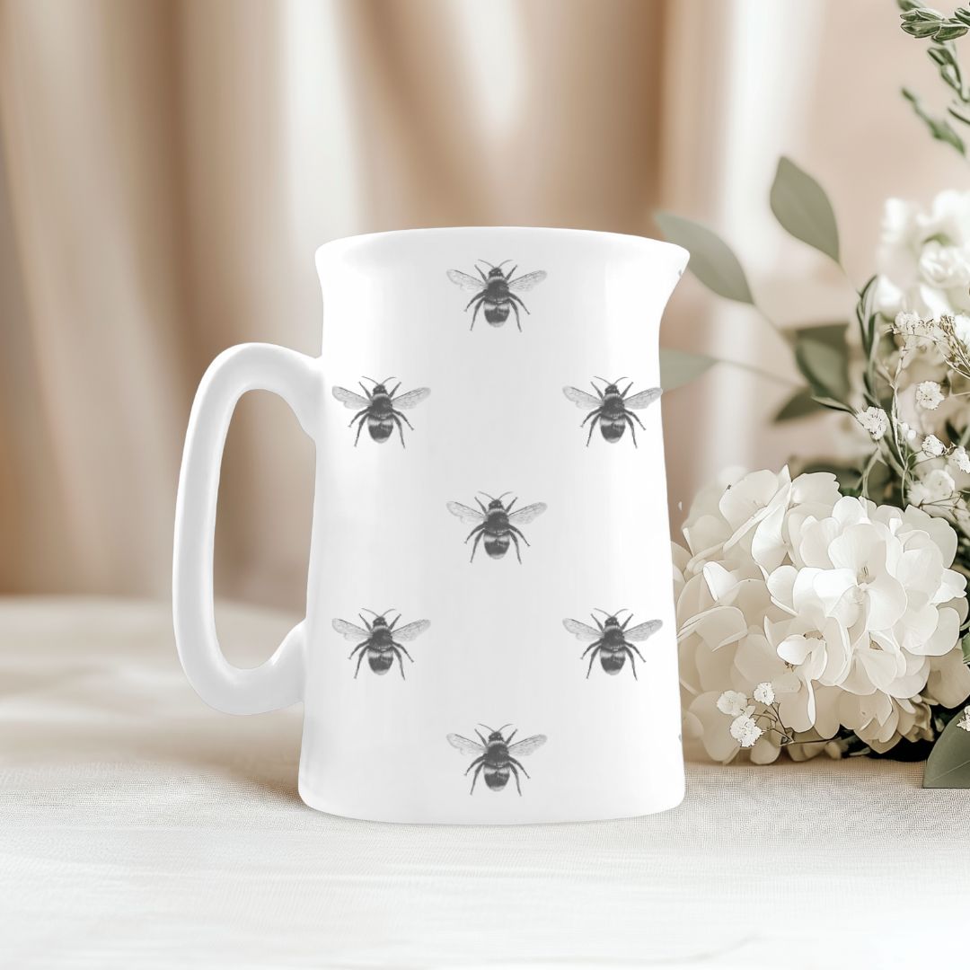 Beautifully illustrated bees buzzing around on a fine bone china jug, ideal for countryside kitchens or gifting.