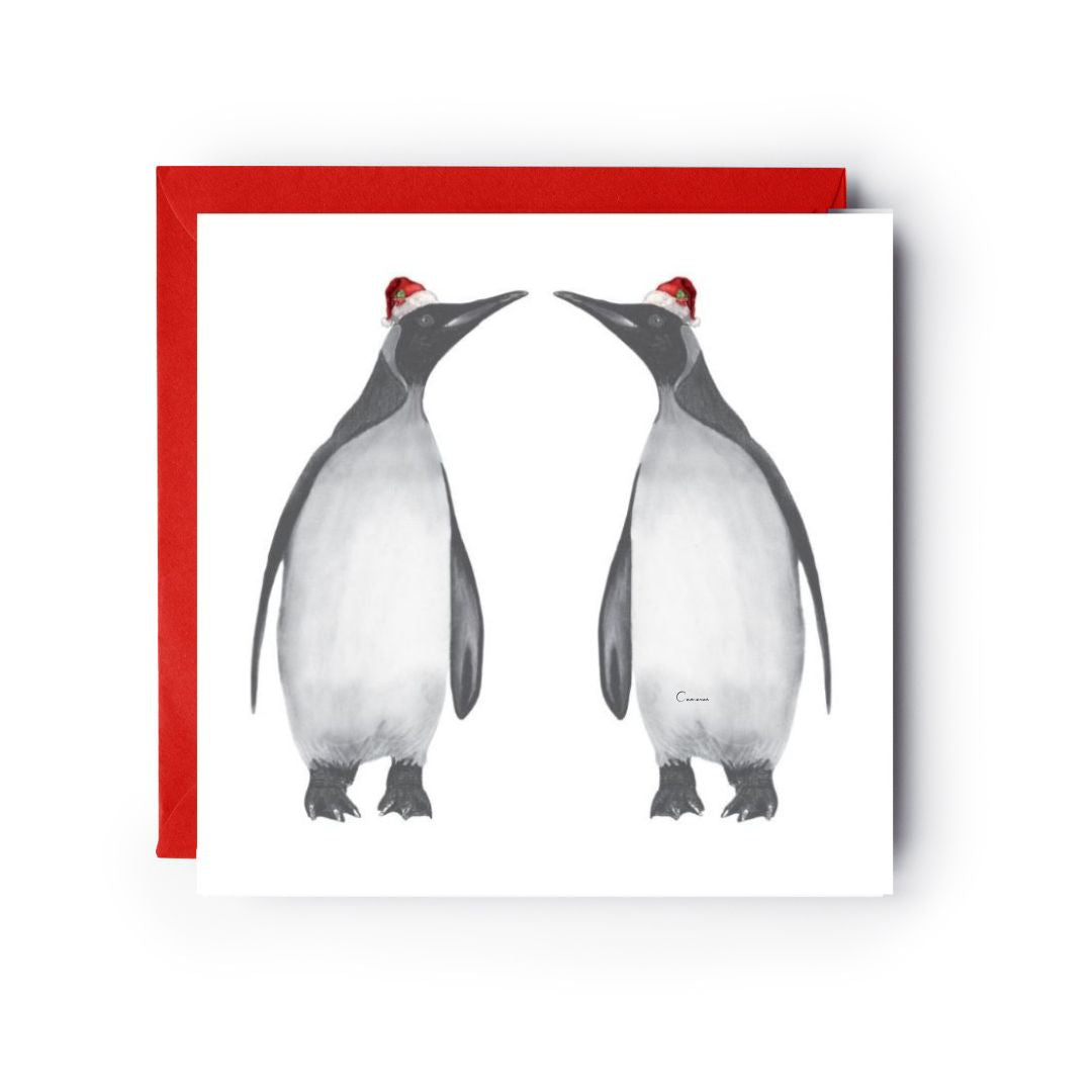 Adorable penguin pair, Alya and friend, in Santa hats, celebrating Christmas together