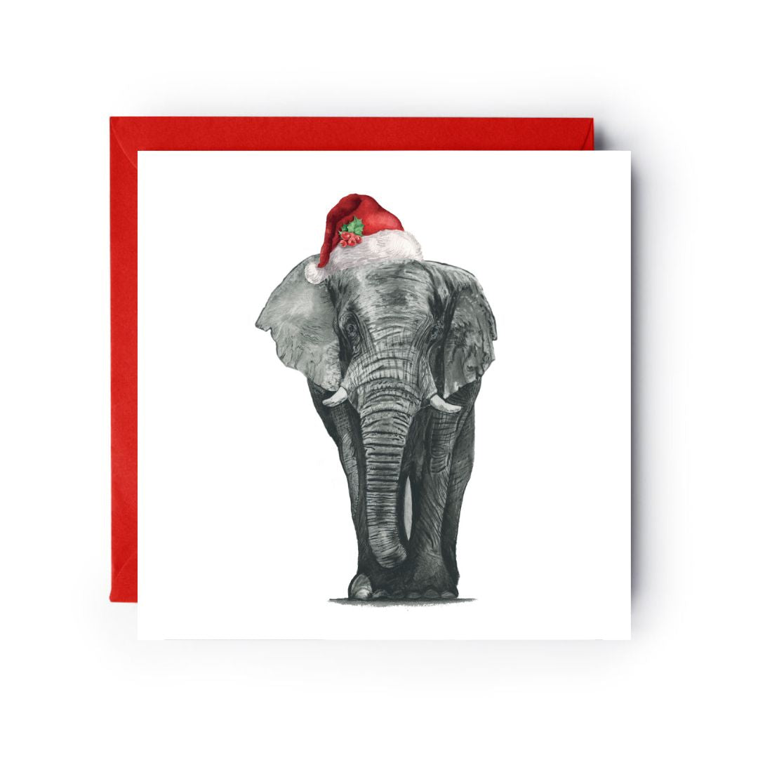 Christmas card featuring Atik the elephant in a Santa hat, bringing holiday joy