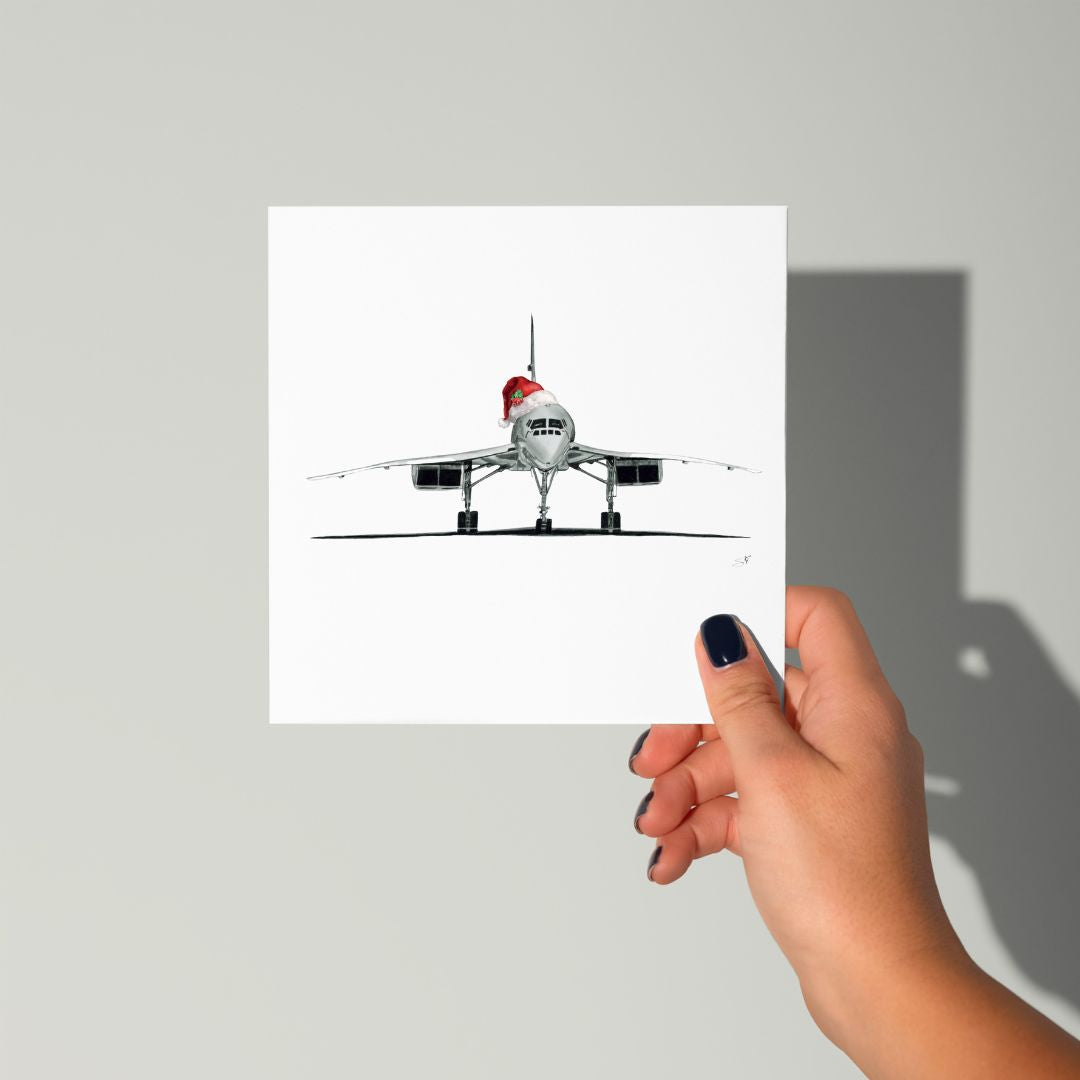 Holiday greeting card with a Concorde aircraft in a Santa hat for Christmas celebrations