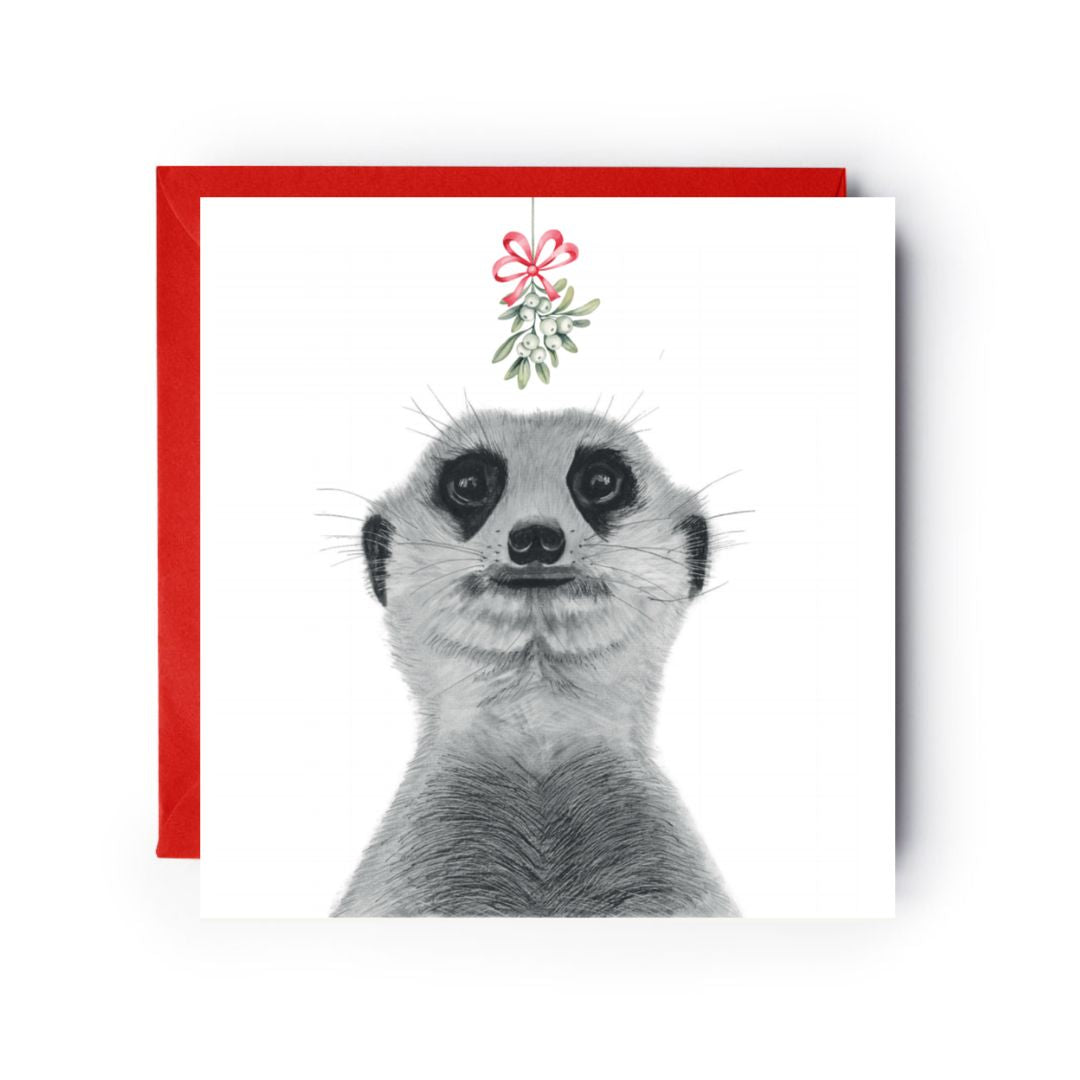 Charming meerkats under mistletoe, exchanging a Christmas kiss, perfect for holiday wishes.