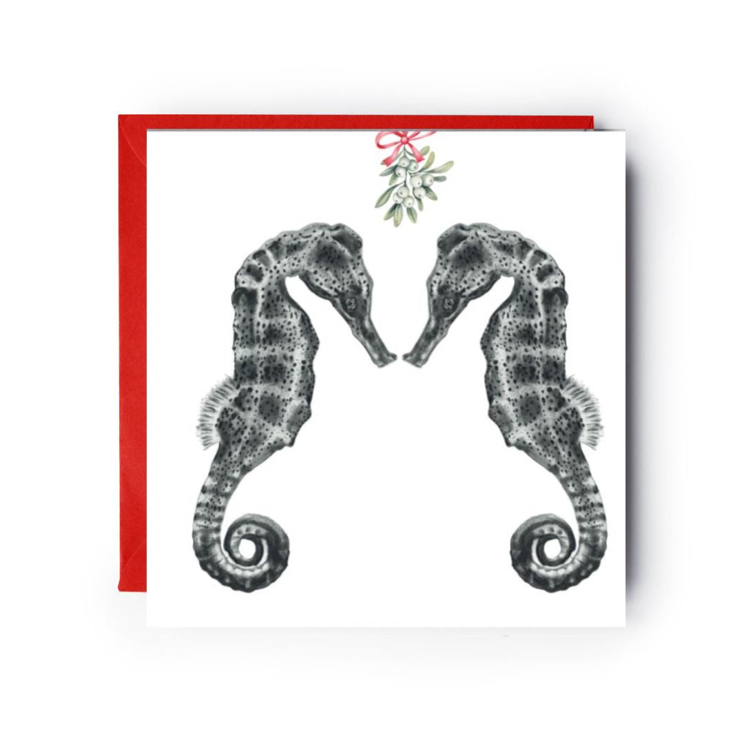 Christmas card featuring Diya the seahorse and friend beneath mistletoe for a merry holiday greeting