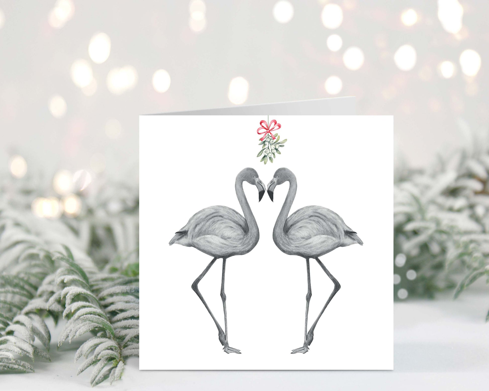 Flamingo couple sharing kisses under the mistletoe, festive red hats on, hand-drawn Christmas greeting card.