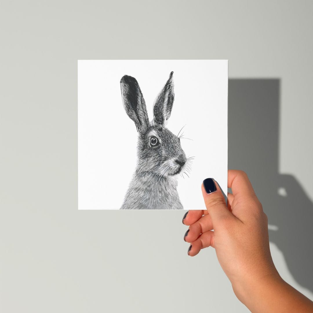 Floras the Hare Greeting Card from Libra Fine Arts, hand-drawn design, being held in a hand, showcasing its intricate countryside-inspired illustration.