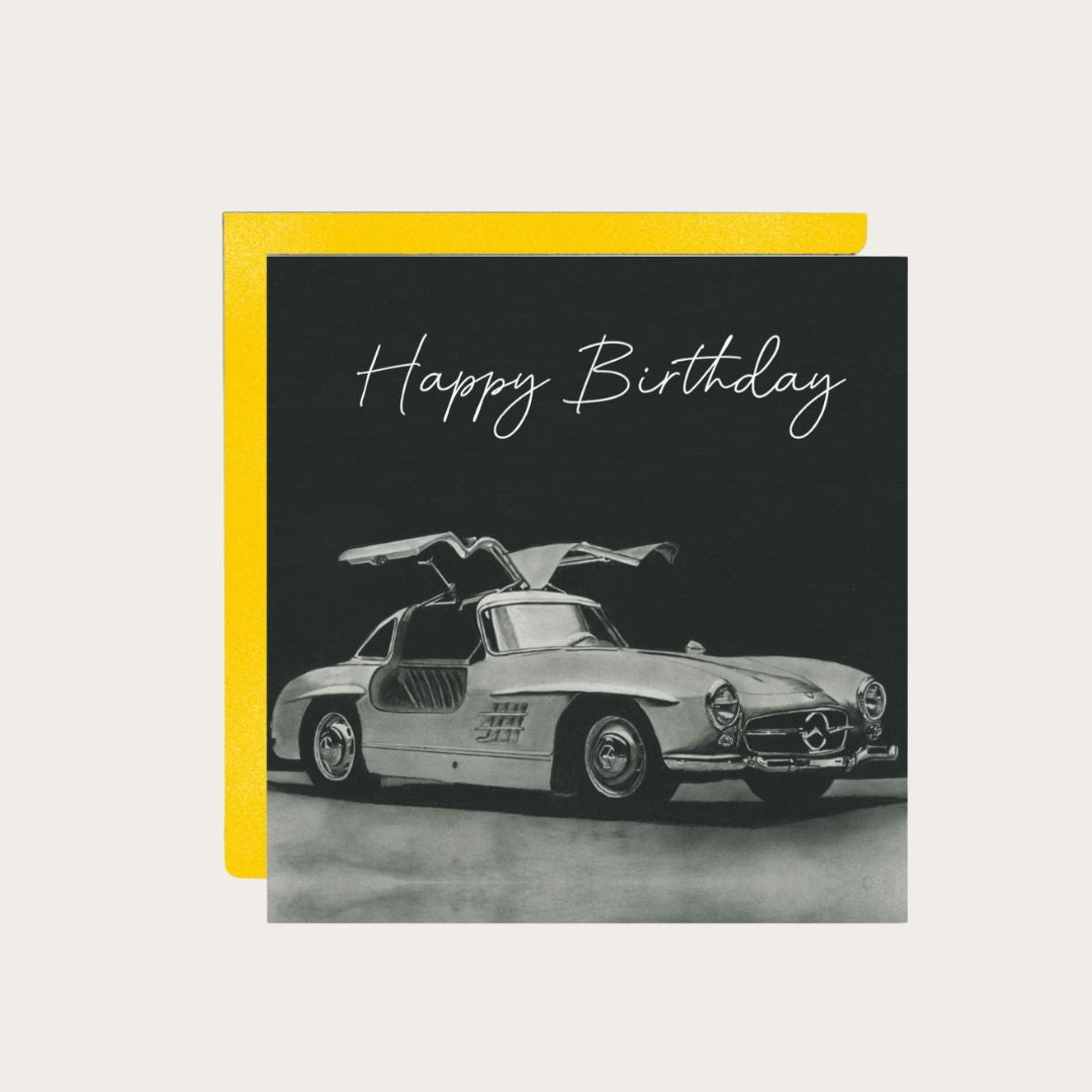 Vintage-style Gullwing car illustration on a Happy Birthday greeting card.