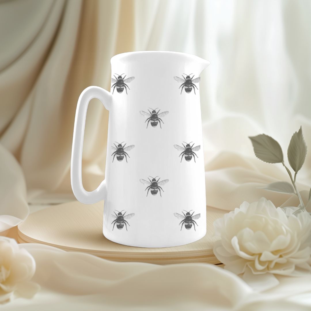 Delicate fine bone china jug featuring hand-drawn busy bees, perfect for springtime tables and nature lovers.