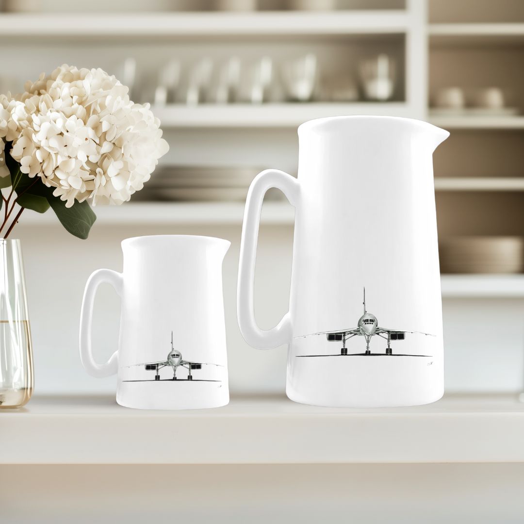 Stylish duo of fine bone china jugs featuring hand-drawn illustrations of the iconic Concorde aircraft, perfect for aviation enthusiasts and collectors.
