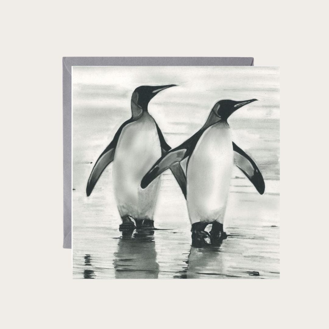 A delightful hand-drawn greeting card featuring a duo of penguins, ideal for spreading joy and festive cheer to friends and family.
