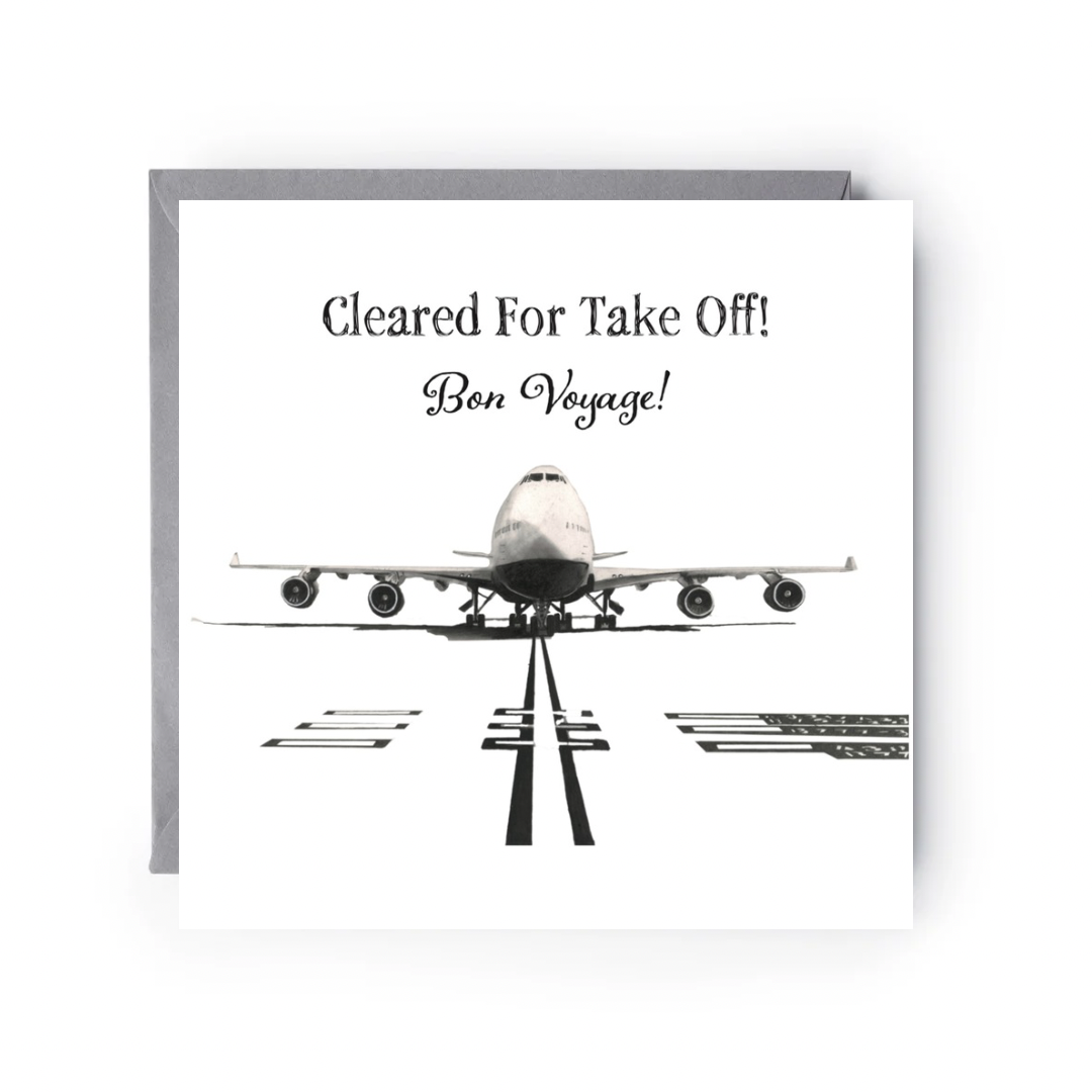 Greeting card with airplane illustration and text 'Cleared For Take Off! Bon Voyage!' on a white background.