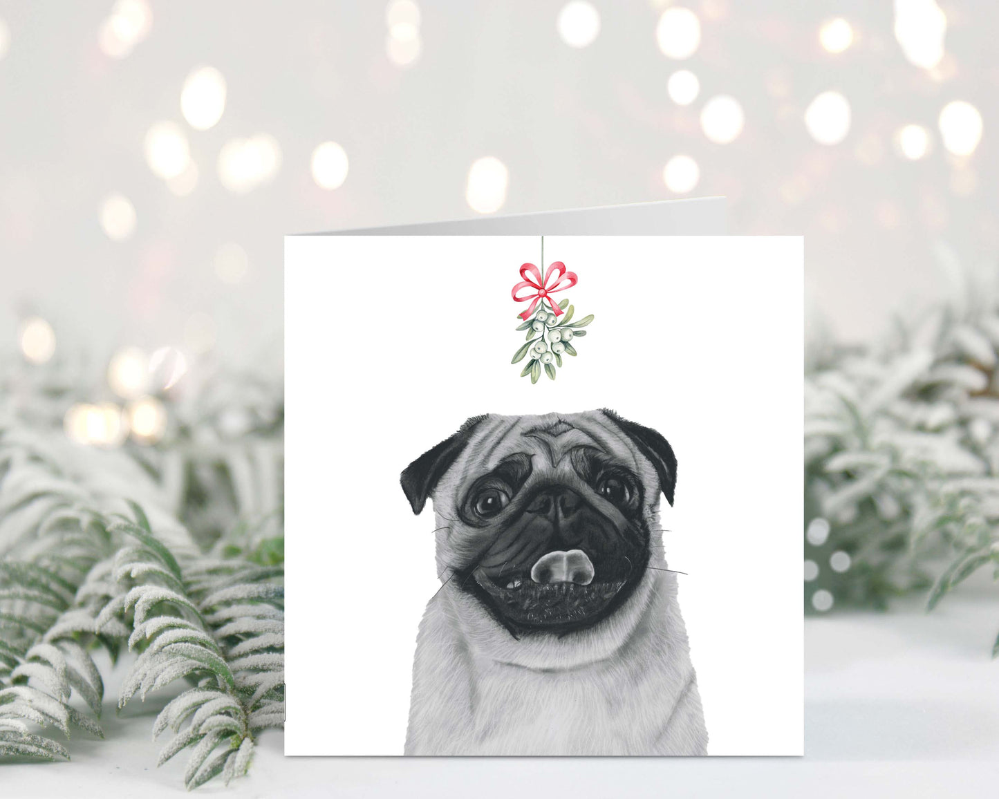 Adorable hand-drawn pug with mistletoe, featured on a festive Christmas greeting card.