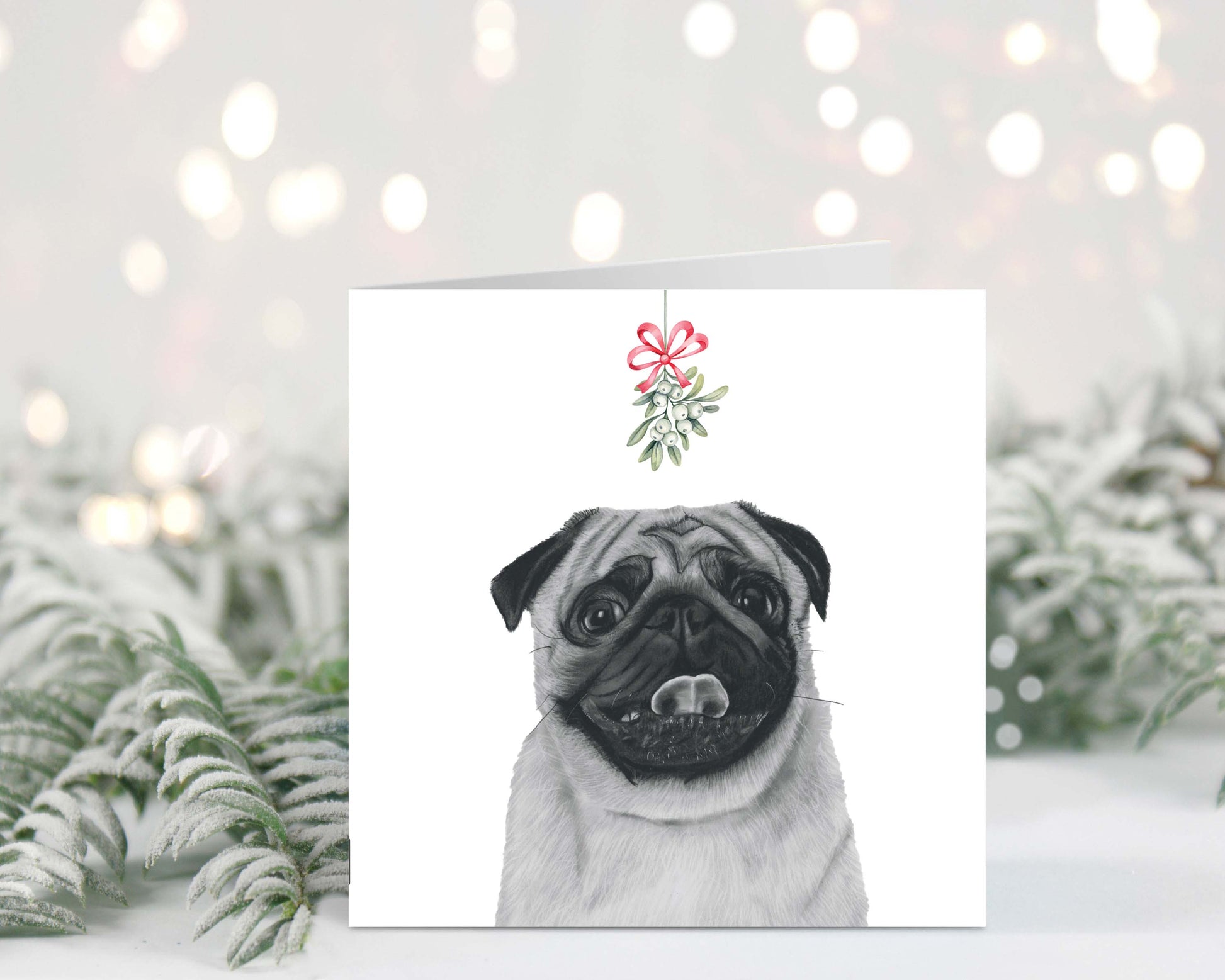 Adorable hand-drawn pug with mistletoe, featured on a festive Christmas greeting card.