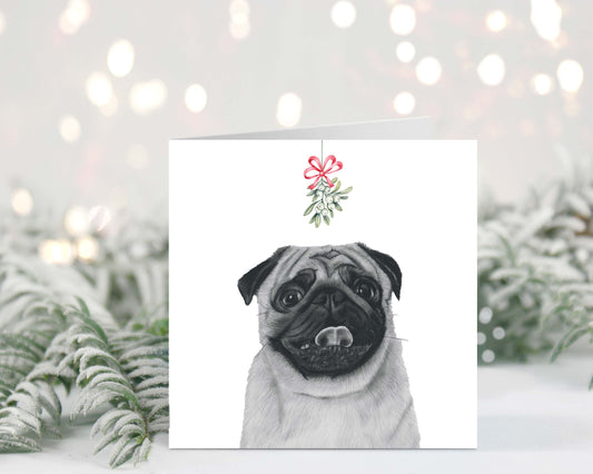 Adorable hand-drawn pug with mistletoe, featured on a festive Christmas greeting card.