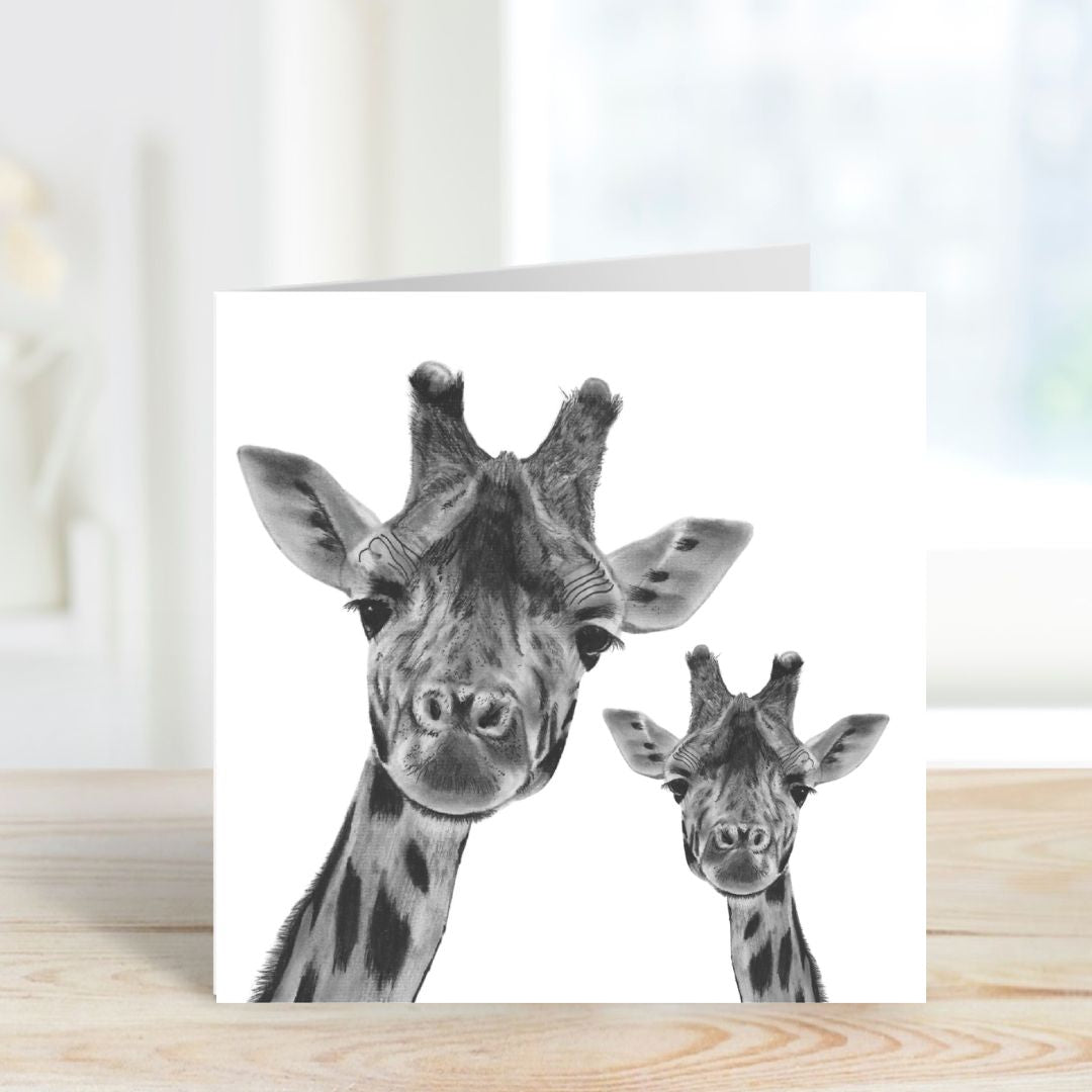Charming hand-drawn greeting card featuring Maya and her baby giraffe, a sweet and playful design ideal for sending love and smiles to friends and family.