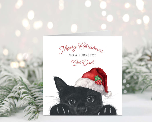 This charming Merry Christmas card for a purrfect cat dad is hand-drawn by Libra Fine Arts, perfect for any cat lover this holiday season