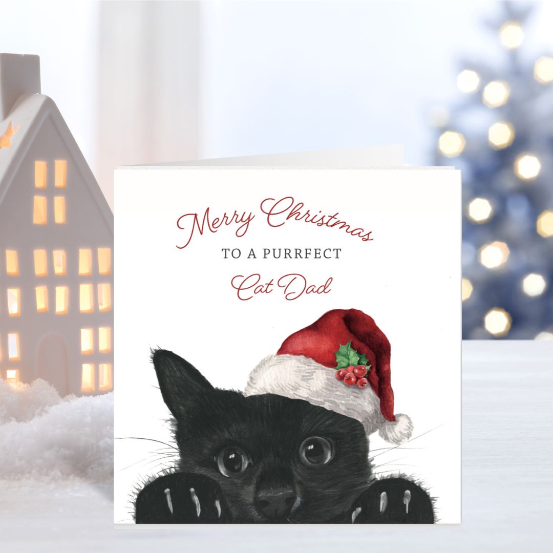 Celebrate a purrfect cat dad this holiday season with this hand-drawn Merry Christmas card by Libra Fine Arts.