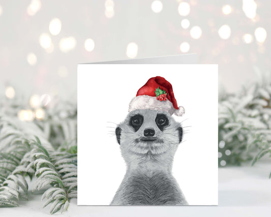 Hand-drawn meerkat wearing a festive Santa hat on a charming Christmas greeting card