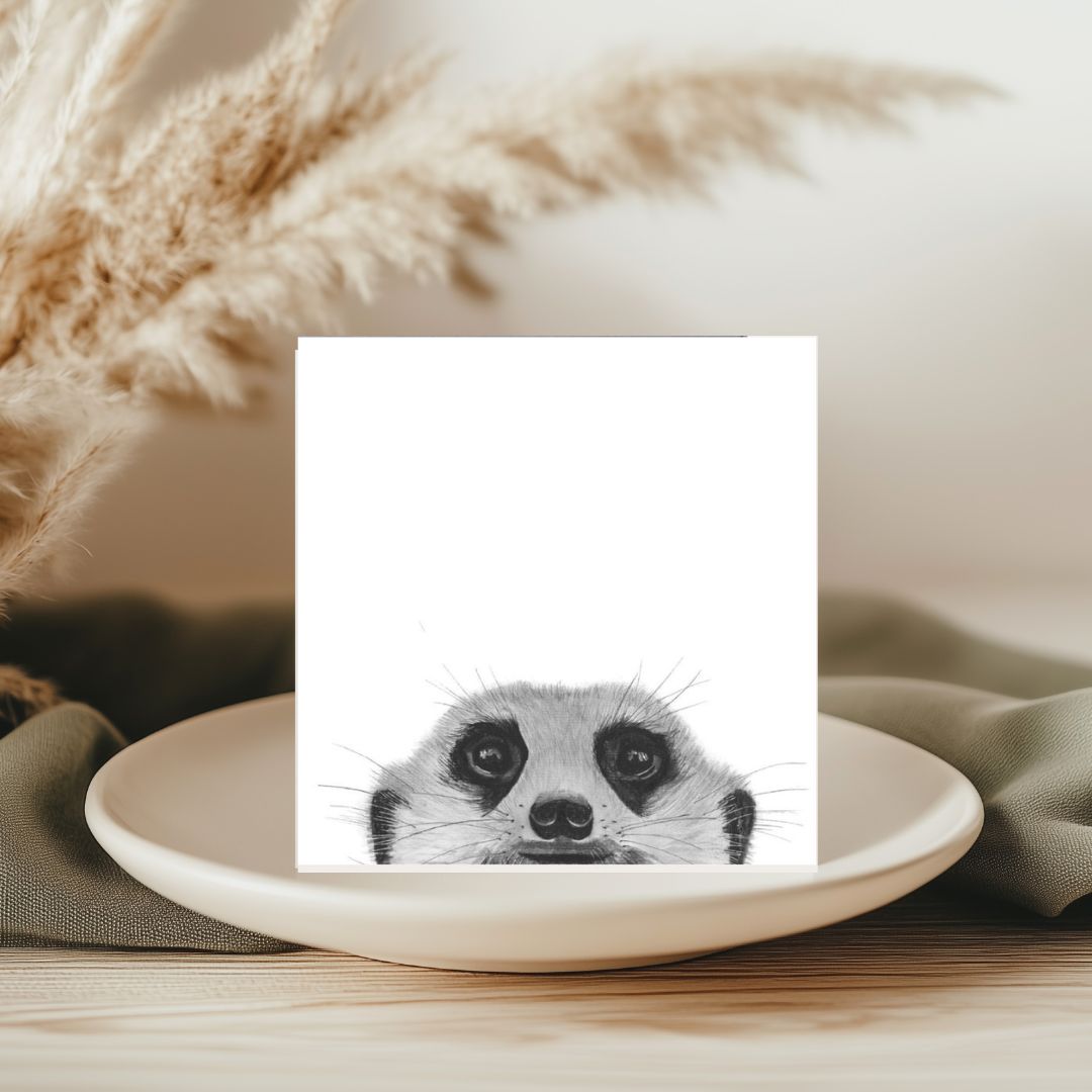 A delightful hand-illustrated greeting card featuring Myra the meerkat peeking from her habitat, perfect for sending cheerful messages to animal enthusiasts.