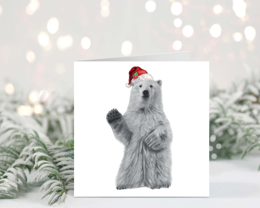 Polar Bear wearing a festive red hat, perfect for spreading Christmas cheer with this adorable Christmas card