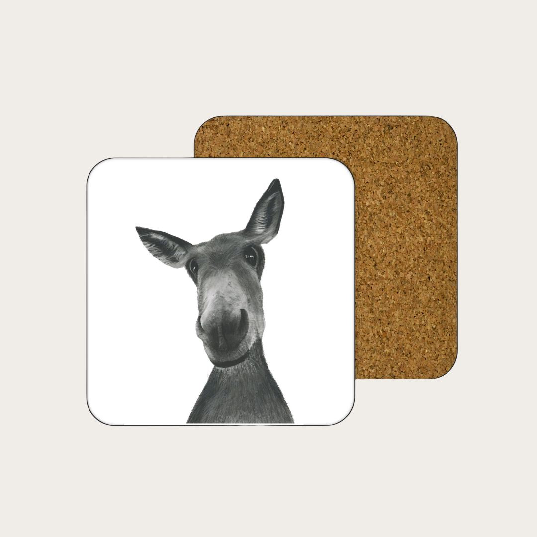 A delightful drinks coaster featuring a hand-drawn illustration of Sirius the Donkey, adding a touch of rustic charm to your table setting. Printed on high-quality, eco-friendly materials, this coaster is both functional and decorative. Perfect for animal lovers and those who appreciate unique, handcrafted designs.