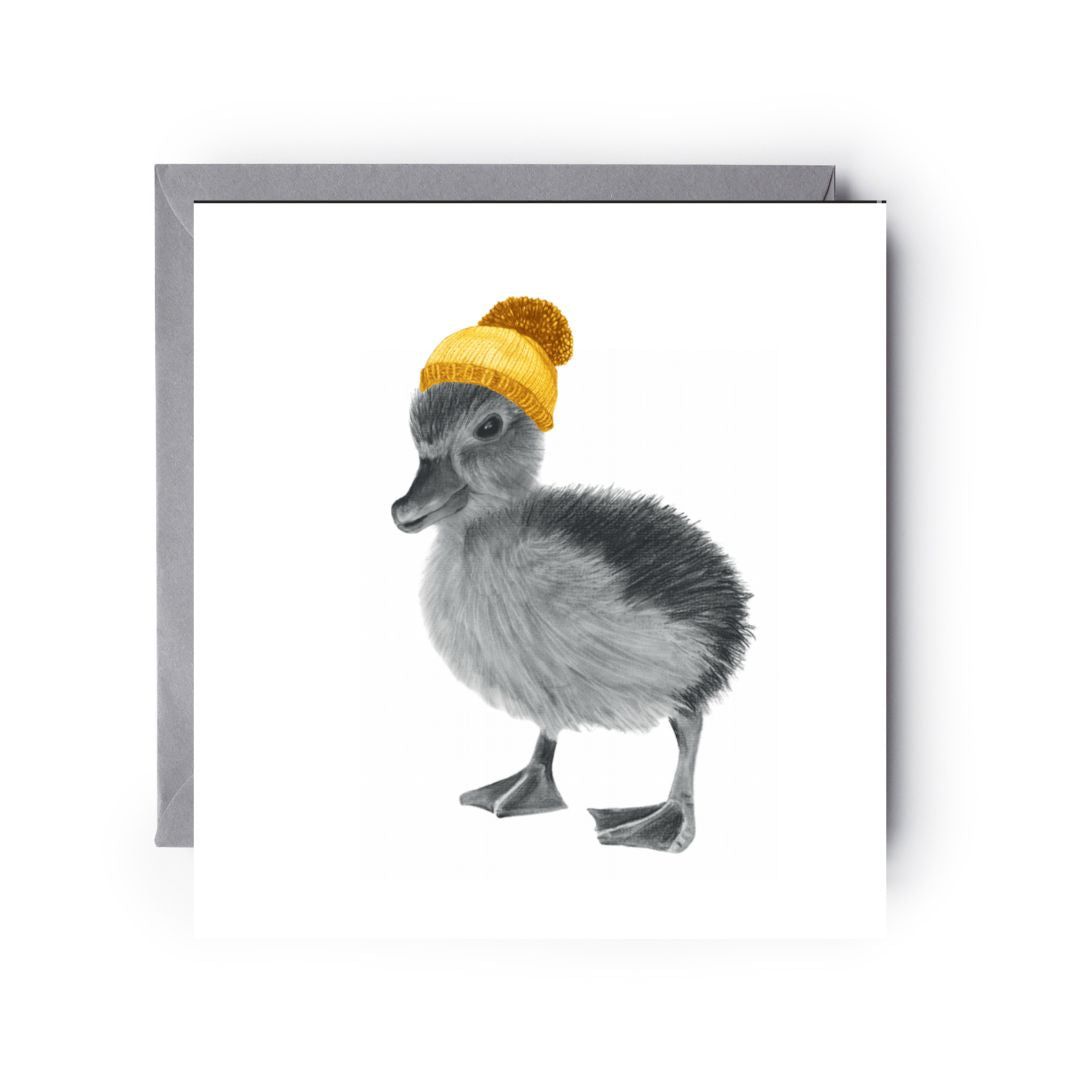 Hand-drawn winter greeting card showing a cute duckling wearing a cosy bobble hat.