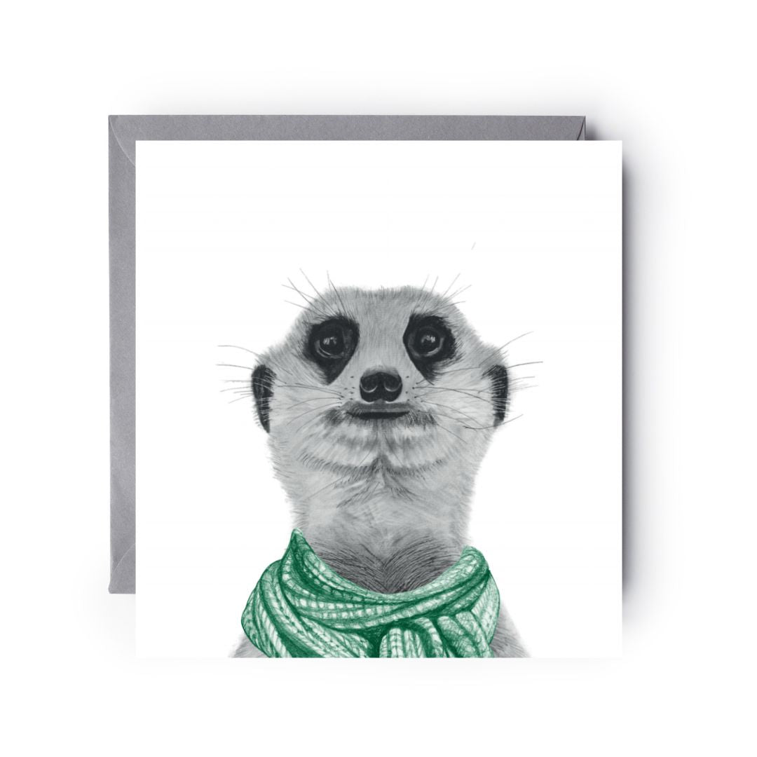 Hand-drawn winter greeting card showing a meerkat wrapped in a warm green scarf.