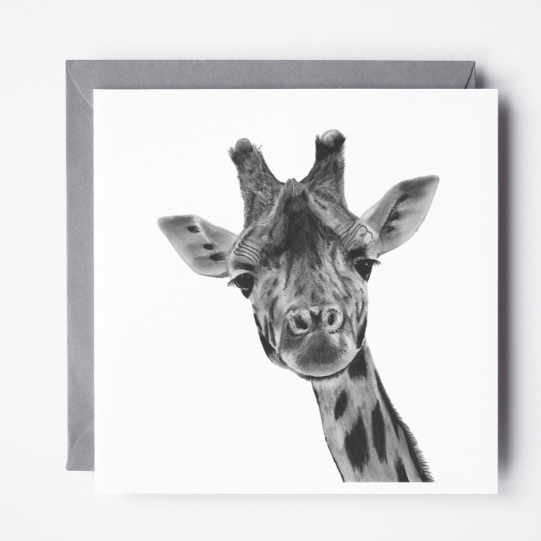 A hand-drawn giraffe greeting card, displayed alongside a grey envelope, highlighting its intricate wildlife illustration. Perfect for giraffe lovers, nature enthusiasts, and animal art admirers. Printed on Libra Fine Arts FSC-certified cardstock, offering a premium, eco-friendly choice. Blank inside, ready for a heartfelt message.