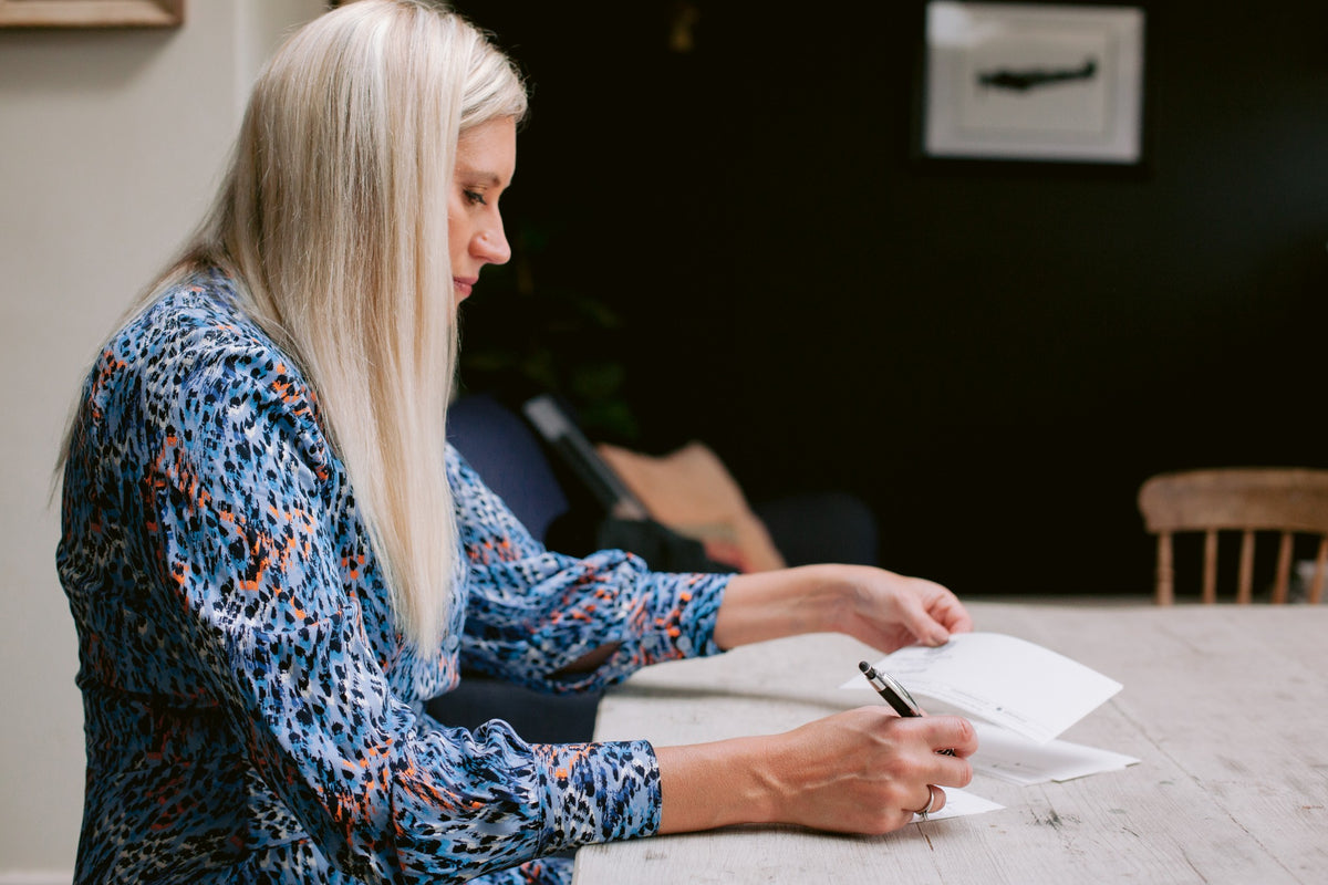 Handwritten card service – a card being personally handwritten with a pen