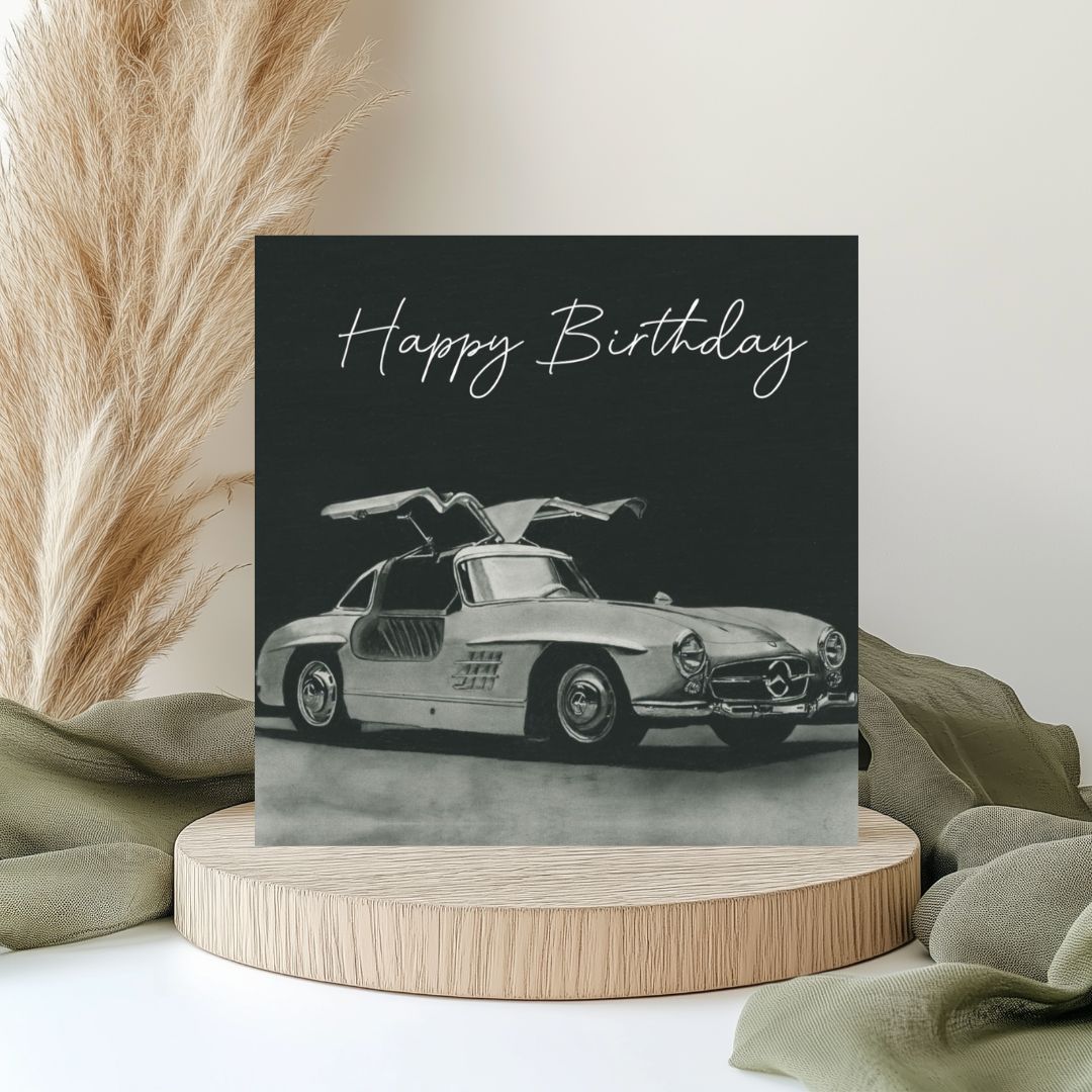 "Hand-drawn Gullwing sports car birthday card, perfect for classic car enthusiasts.