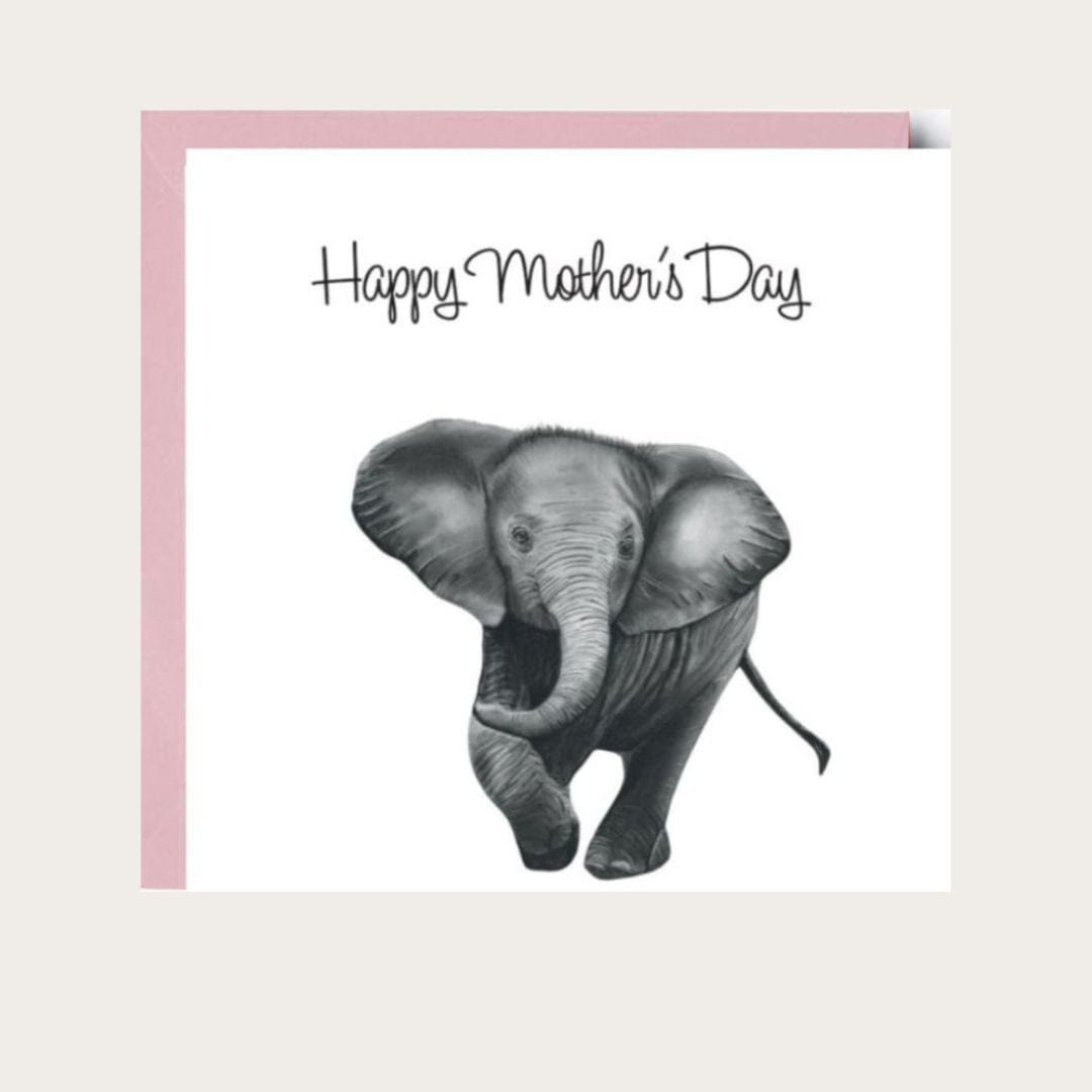 A Happy Mother’s Day greeting card featuring an adorable hand-drawn baby elephant, with a heartwarming design to celebrate moms. The card is paired with a soft pink envelope, adding a touch of warmth and charm to the special occasion.