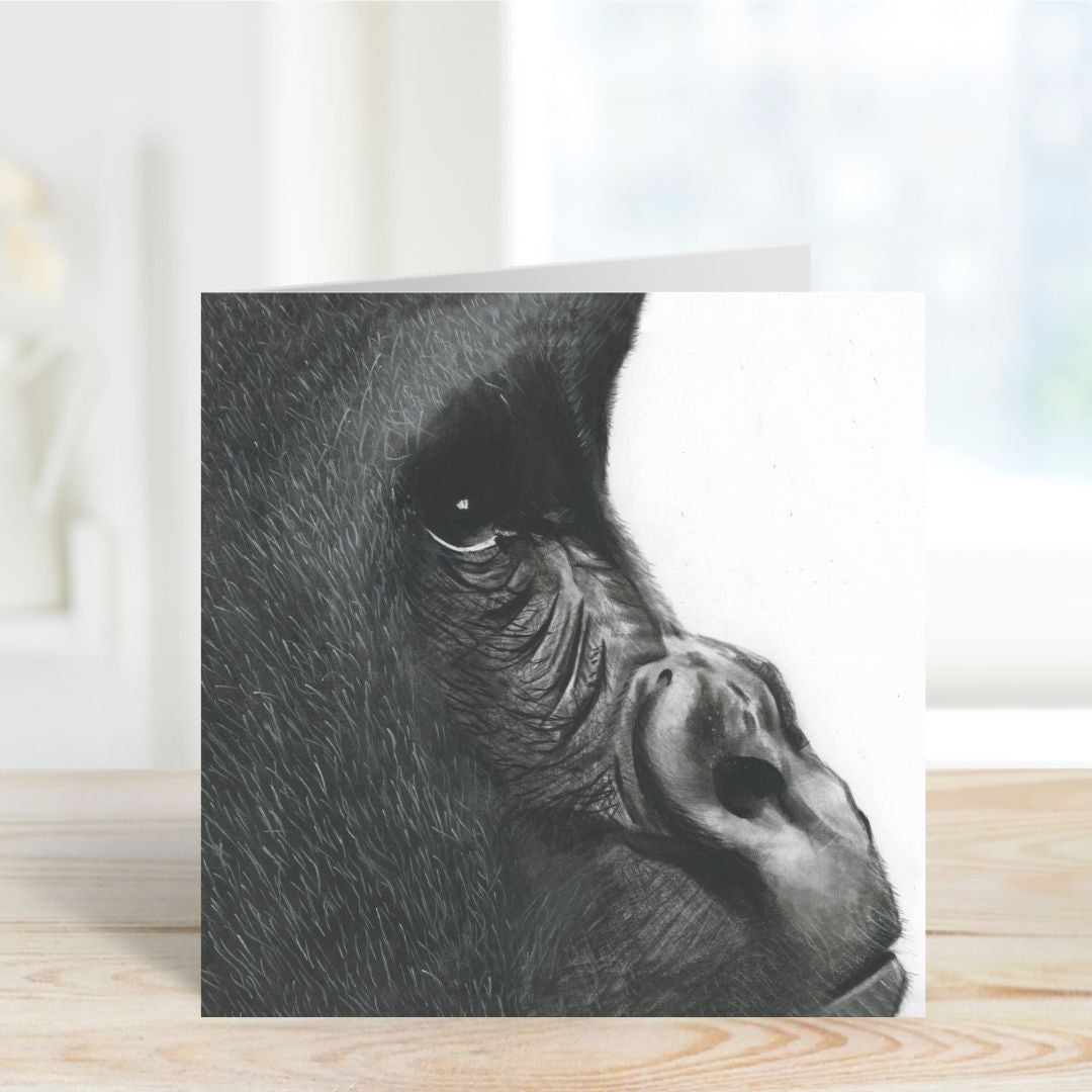 A Hand Drawn Gorilla Greeting Card from Libra Fine Arts, standing on a shelf, showcasing the intricate illustration of Orion the Gorilla.
