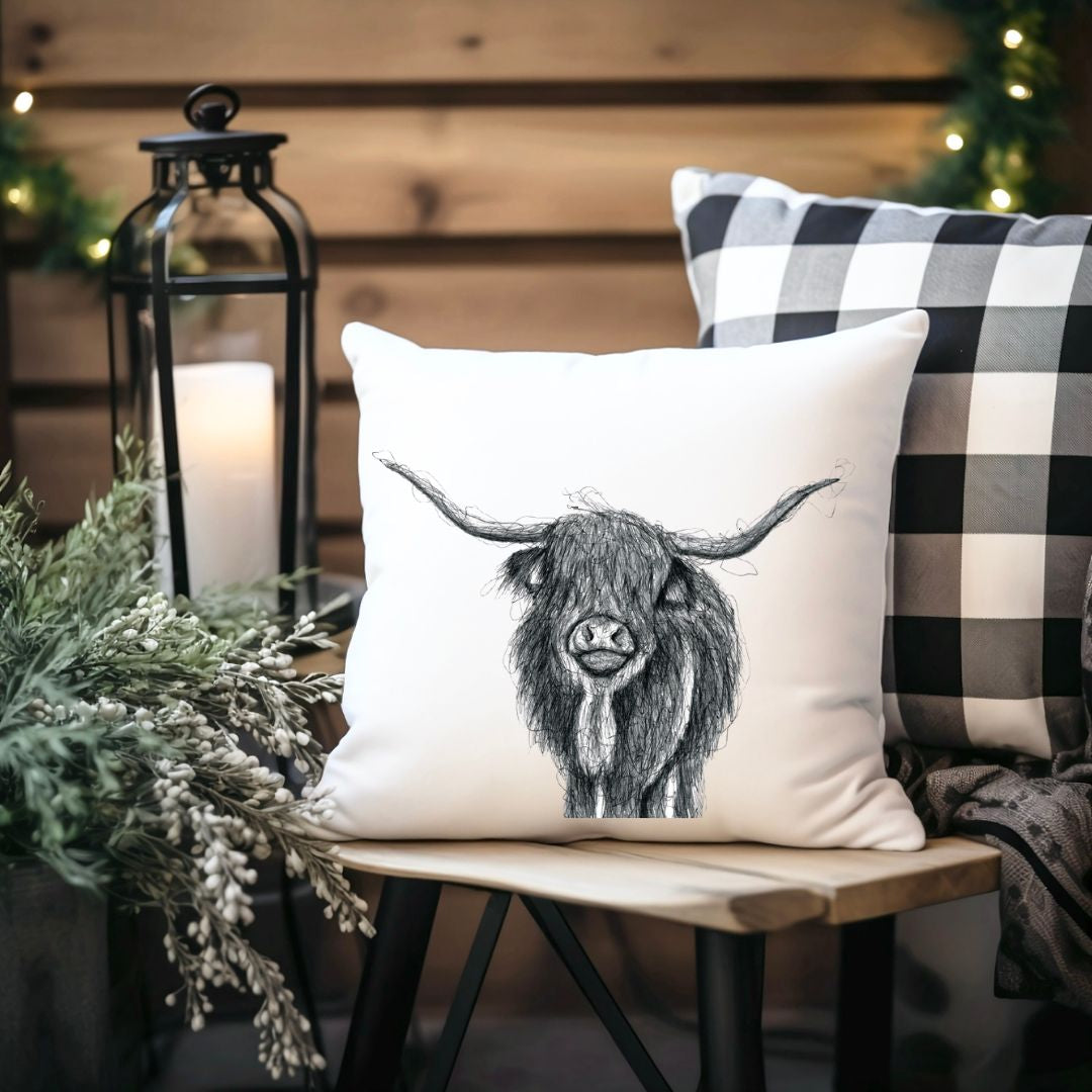 Highland cow cushion from Libra Fine Arts