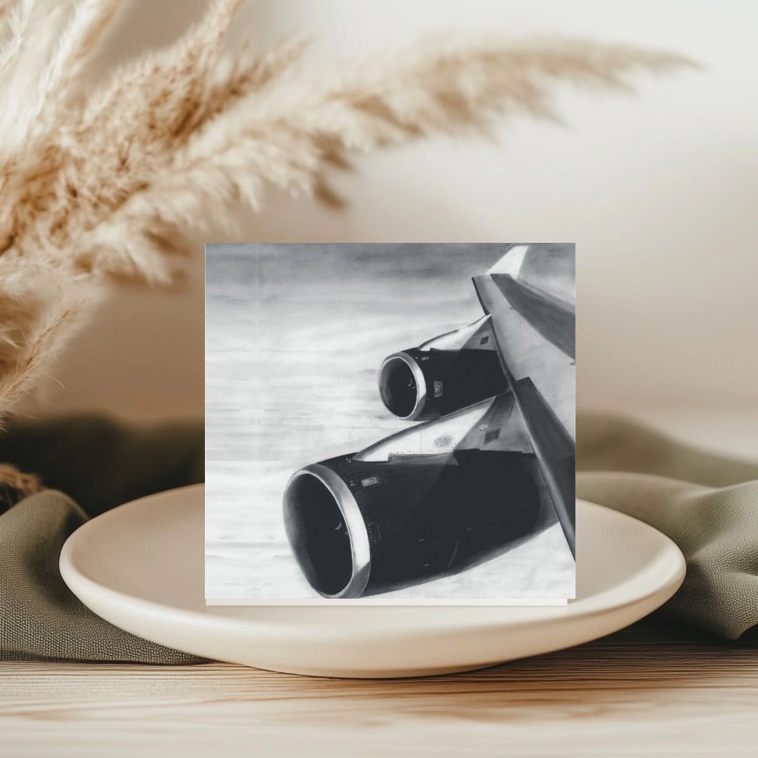 An intricately hand-illustrated greeting card featuring a Boeing 747 wing in flight, capturing the majesty of aviation. Printed on high-quality, eco-friendly cardstock, it includes a matching envelope and is left blank inside for your personal message. Available at Libra Fine Arts.​