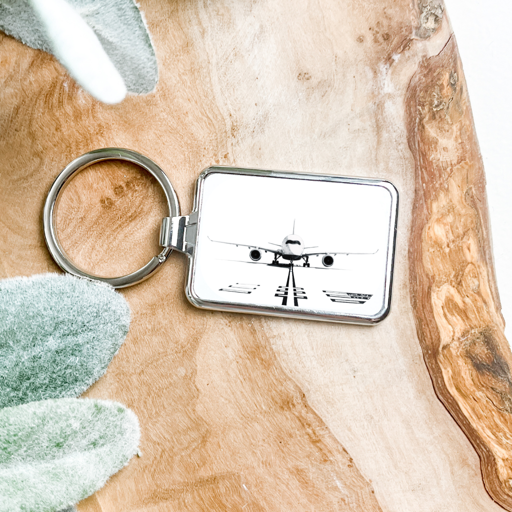 Silver A350 metal keyring featuring a detailed airplane design with sturdy keyring loop.