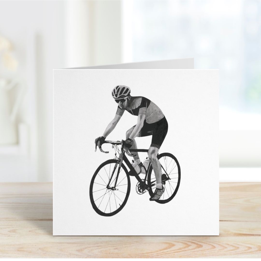 A Hand-Drawn Cyclist Greeting Card standing on a shelf from Libra Fine Arts, showcasing a dynamic illustration of a cyclist in motion—perfect for sports lovers and cycling enthusiasts.