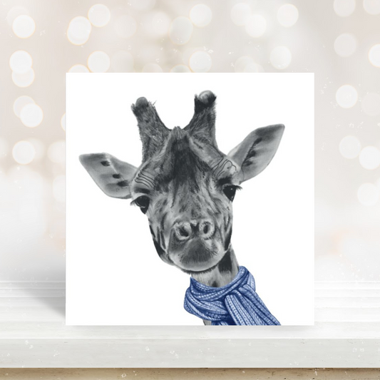 Cute illustration of a giraffe wrapped in a blue scarf on a charming card.

