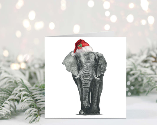 Atik the elephant wearing a Santa hat on a festive Christmas greeting card