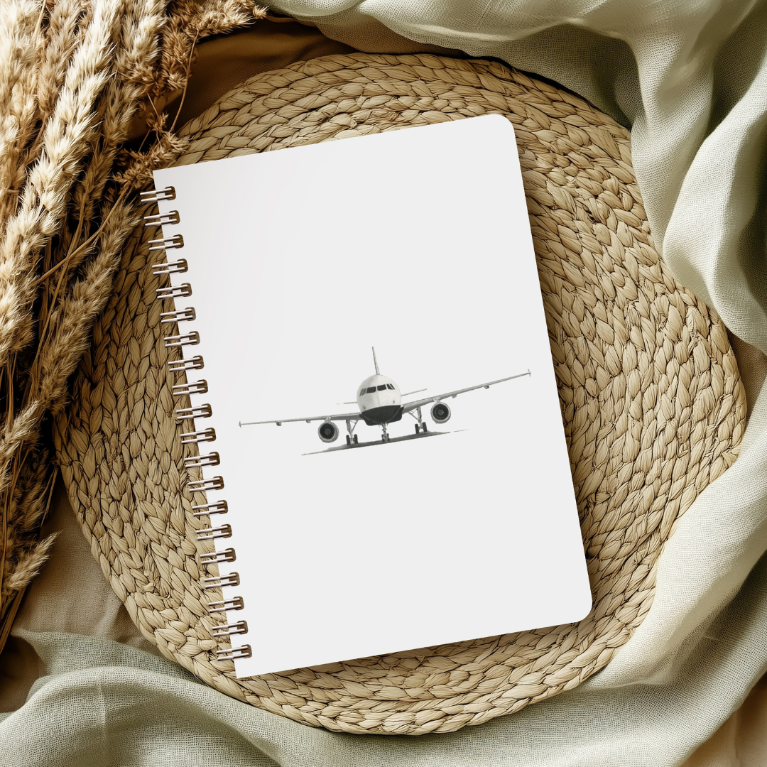 Aviation art notebook with hand-drawn Airbus A320, fine line aircraft drawing on lined pages, ideal gift for pilots, travelers, and aviation fans.