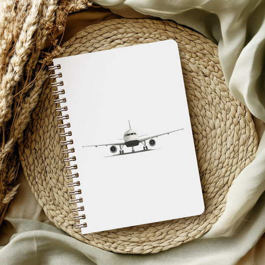 Aviation art notebook with hand-drawn Airbus A320, fine line aircraft drawing on lined pages, ideal gift for pilots, travelers, and aviation fans.