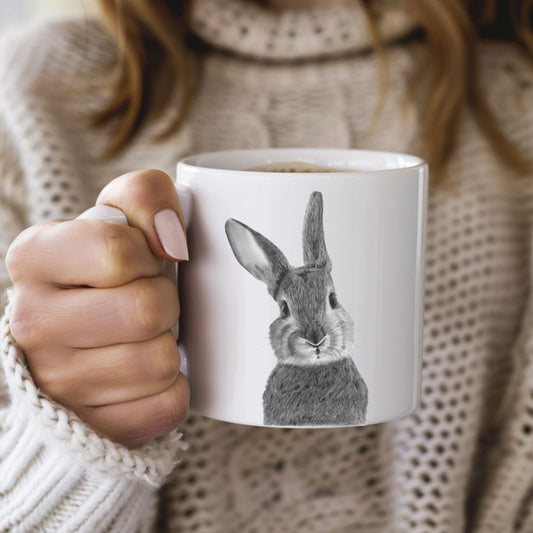 Beautiful hand-drawn bunny bone china mug, featuring a cute rabbit illustration, perfect countryside gift for animal lovers and tea enthusiasts.