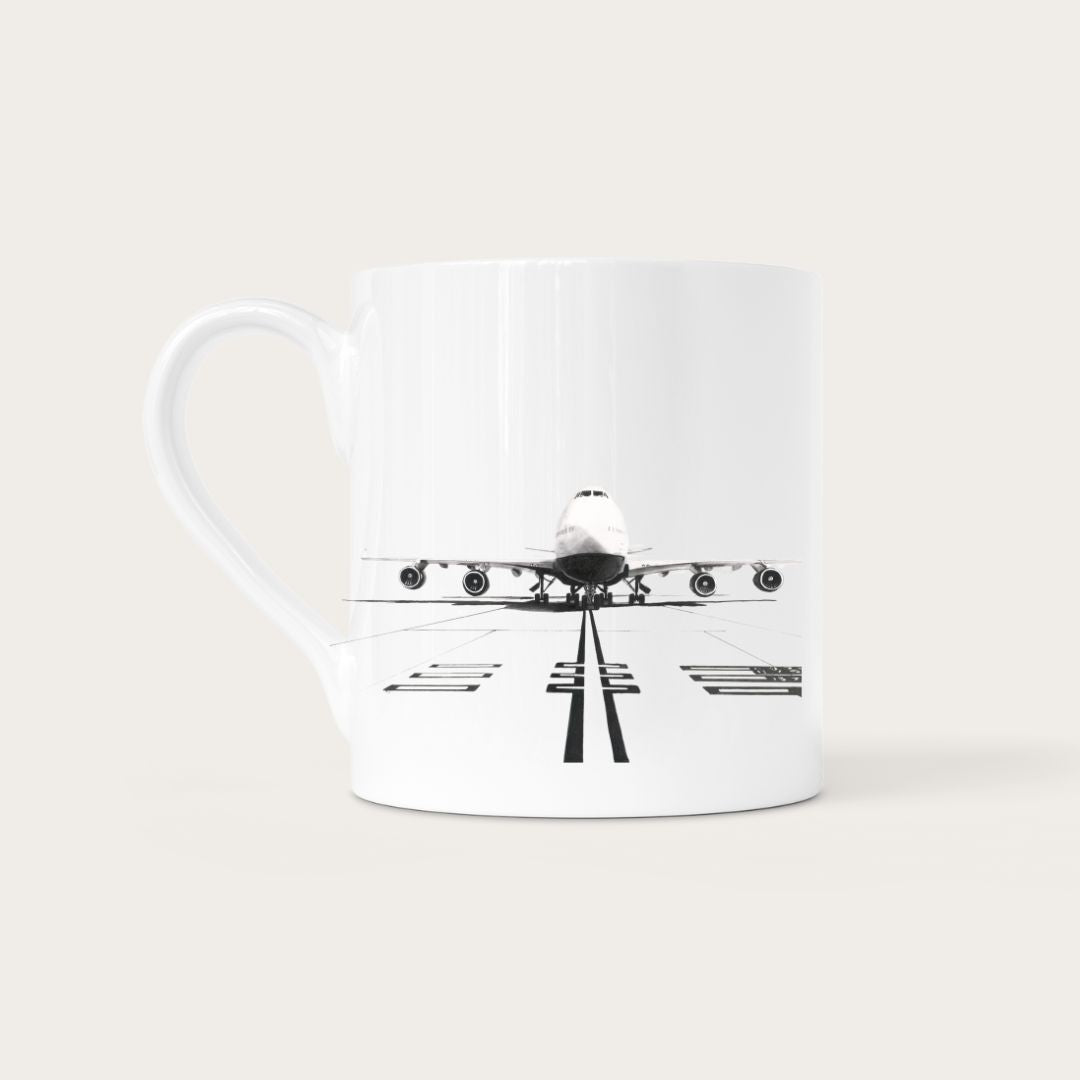 Celebrate the legendary Boeing 747 with this premium fine china mug. Adorned with a stunning illustration of the aircraft, this mug offers a sophisticated yet practical way to show off your love for aviation. Perfect for your morning coffee or as a unique gift for aviation aficionados.
