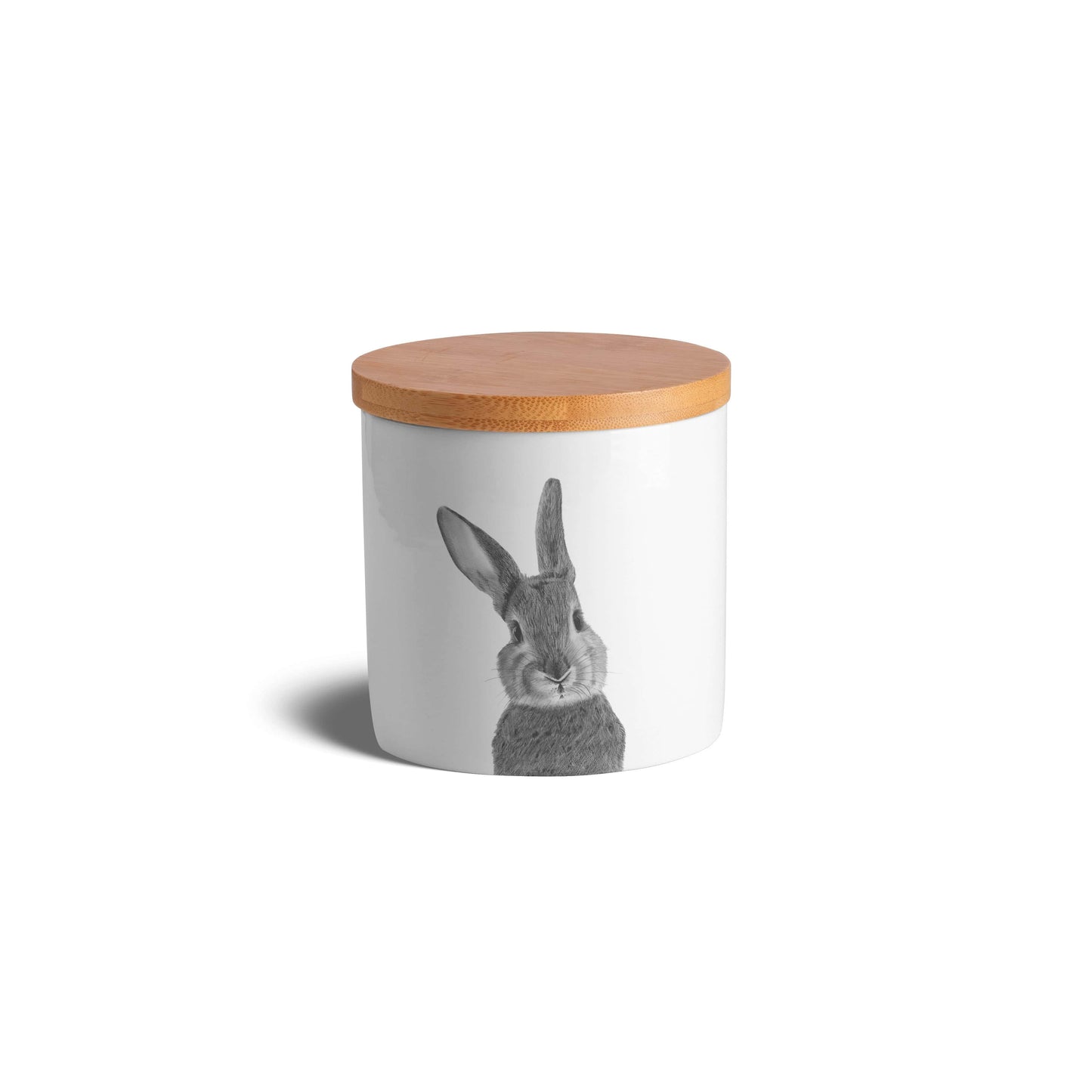 Charming bone china jar decorated with a cute hand-drawn bunny, adding a touch of countryside charm to your kitchen essentials.

