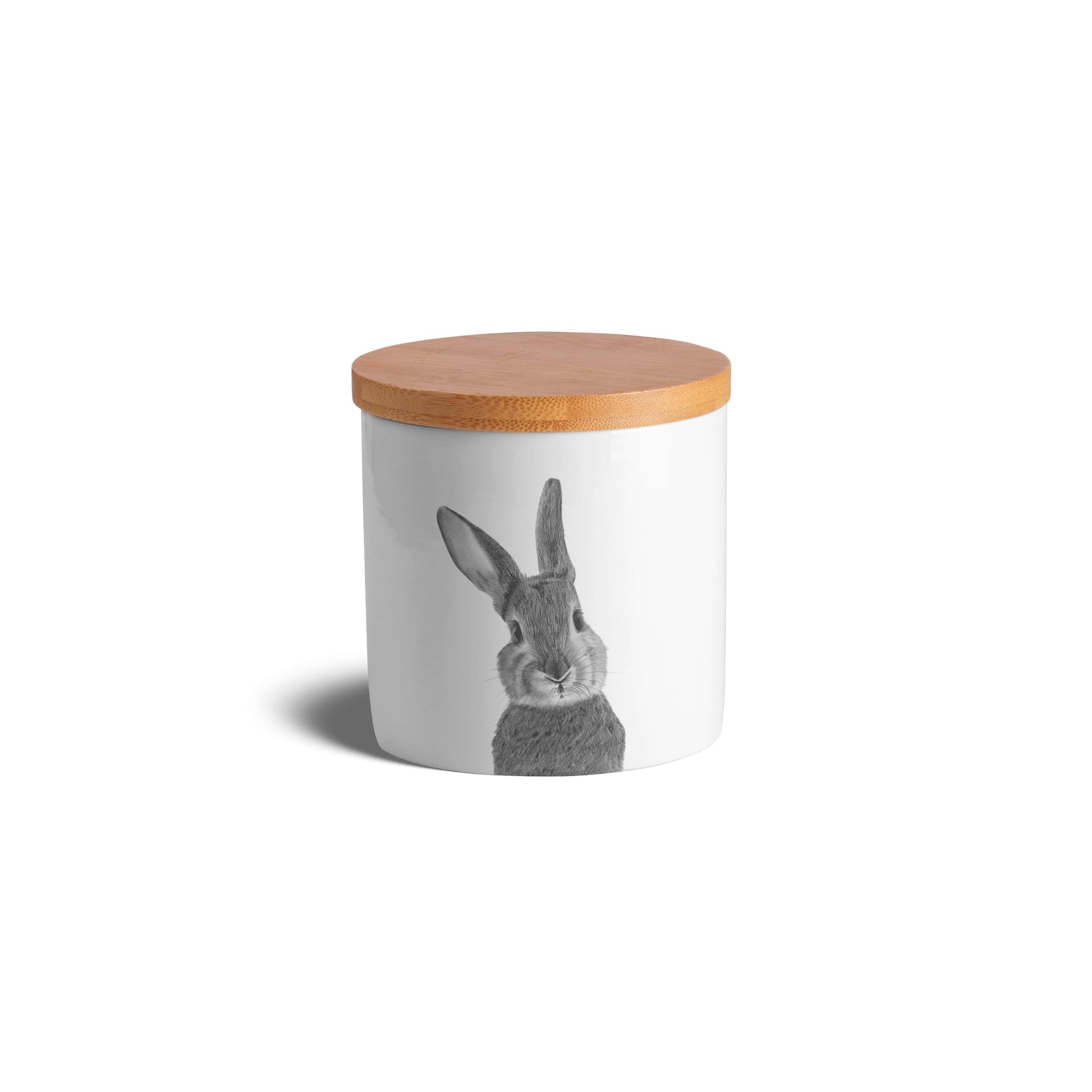 Charming bone china jar decorated with a cute hand-drawn bunny, adding a touch of countryside charm to your kitchen essentials.

