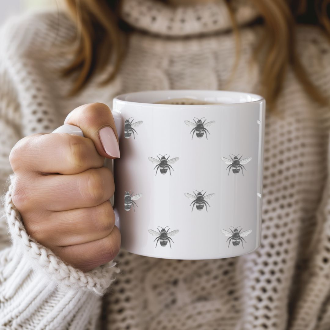 This beautiful Busy Bees Bone China Mug features a hand-illustrated design of buzzing bees, perfect for nature lovers and tea enthusiasts. With its delicate bone china construction, this mug offers both elegance and charm, making it a lovely addition to your kitchen or a thoughtful gift for bee lovers