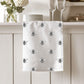Premium cotton tea towel featuring a delightful busy bee design, perfect for adding a touch of nature to your kitchen. A lovely gift for bee lovers and eco-conscious home decor.