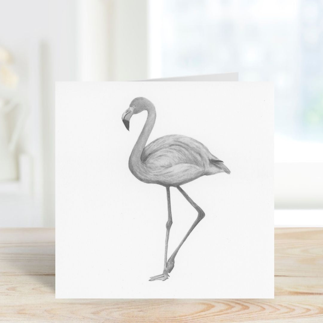Hand-drawn illustration of Celeste the Flamingo on a greeting card, featuring elegant and whimsical design elements.