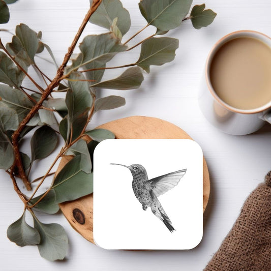 Charming hand-drawn hummingbird drinks coaster, featuring delicate bird art, perfect for nature lovers, birdwatchers, and adding a touch of elegance to your home decor."