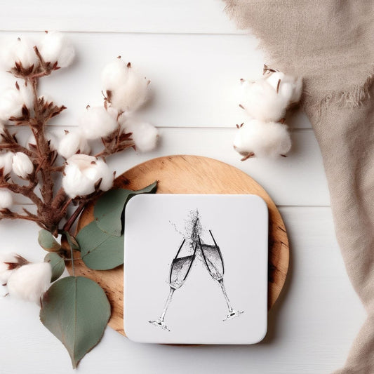 hand-drawn 'Cheers' champagne drinks coasters by Libra Fine Arts, featuring elegant clinking champagne glasses in a timeless design. Perfect for celebrations, weddings, anniversaries, and special occasions.
