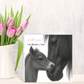 Card with horse illustration and 'On Mother's Day' text next to a vase of pink tulips.